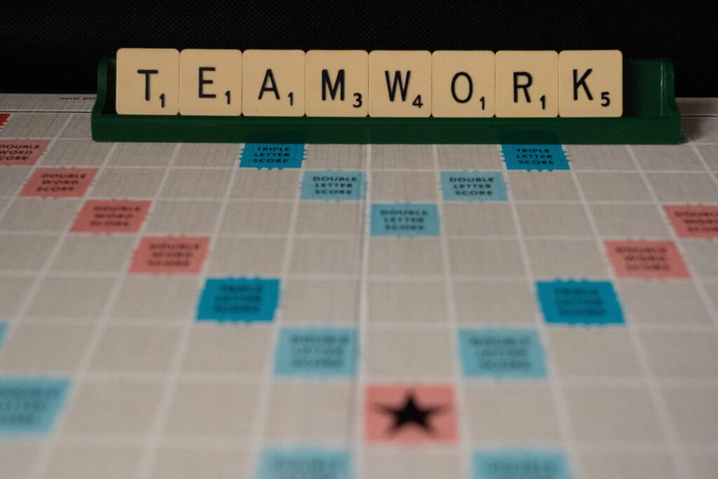 the word teamwork spelled with scrabble letters